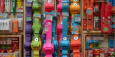 Colourful array of pet training harnesses and agility accessories on shop shelf
