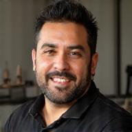 Carlos Estevez, Head Groomer at Paws & Tails